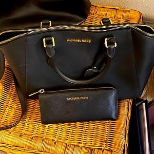 Large cross body duffle with gold hardware. New without tags.